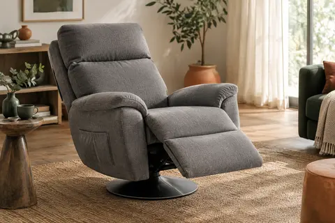 Fauteuil relax gris pivotant et inclinable, repose-pieds déployé dans un salon lumineux